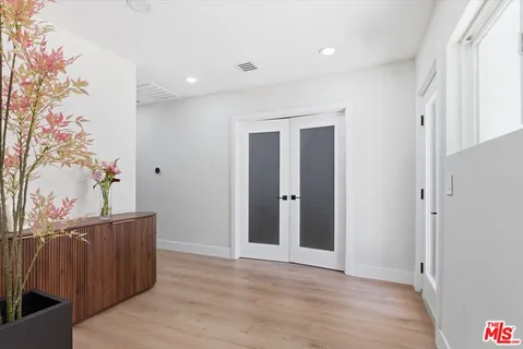 a view of entryway with wooden floor