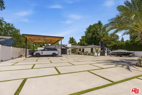 a view of a patio with swimming pool