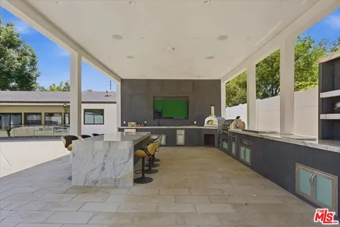 a view of a living room and kitchen