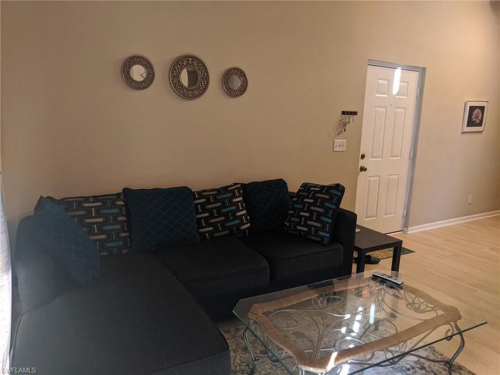 13521 Eagle Ridge Drive, Unit 121 Fort Myers, FL 33912 - Photo 4 of 12 a living room with furniture