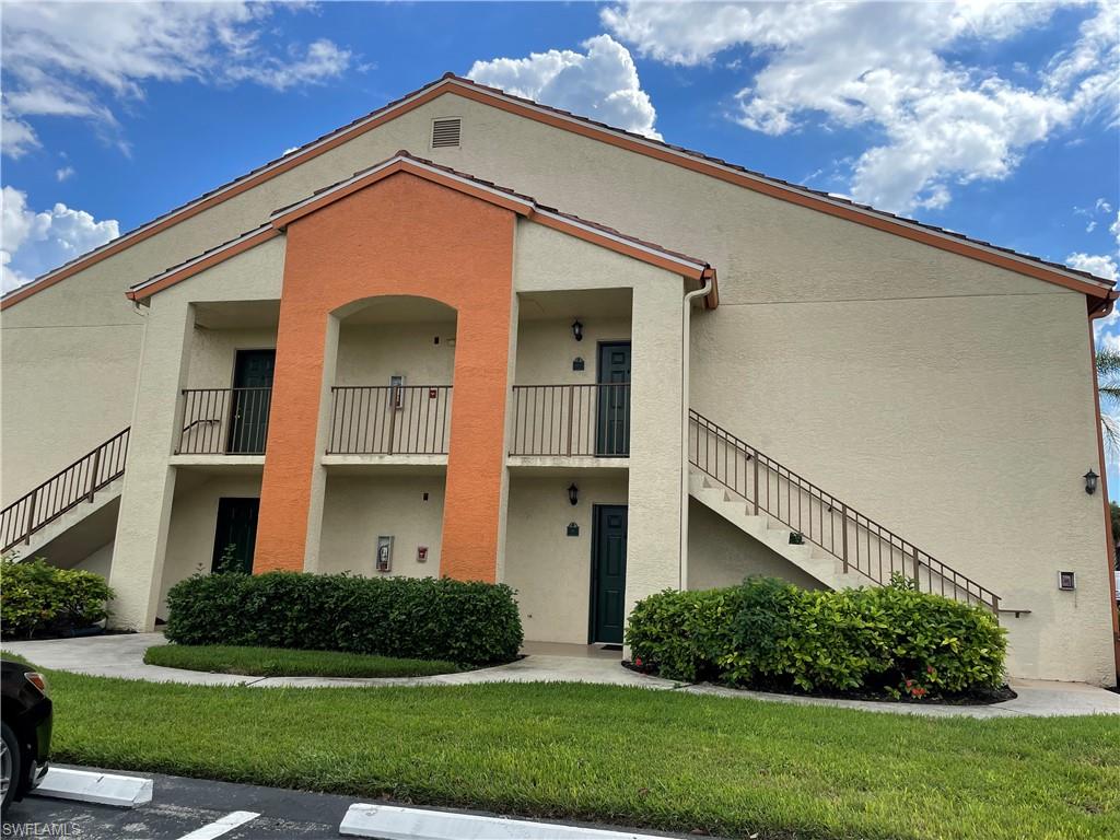 13521 Eagle Ridge Drive, Unit 121 Fort Myers, FL 33912 - Photo 10 of 12 a front view of a house with a yard