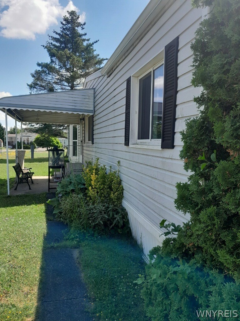 6035-63 South Transit Road, Unit 63 Lockport, NY 14094 - Photo 1 of 1 AWNING COVERED SIDE PATIO