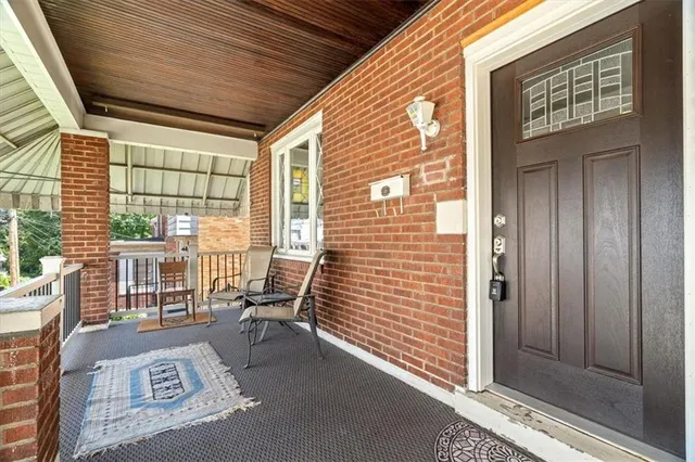 a view of balcony with furniture