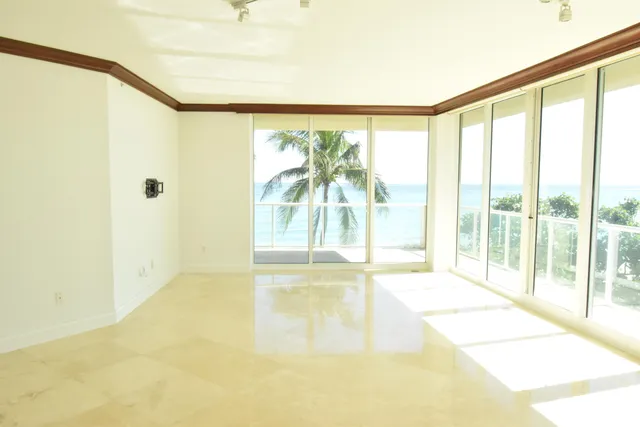 a view of an empty room and a window