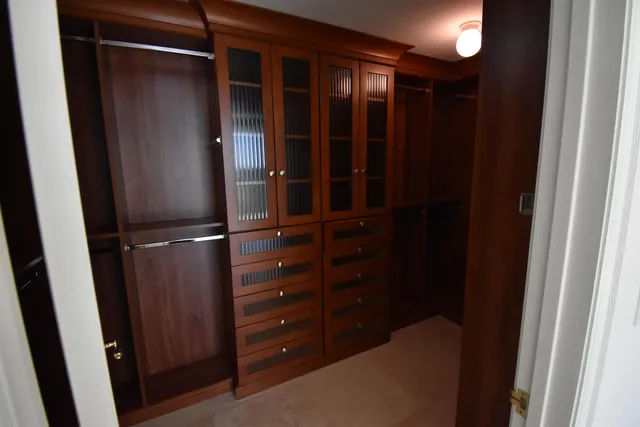 a spacious bathroom with a tub shower and sink