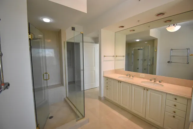 a white toilet sitting next to a bathroom sink