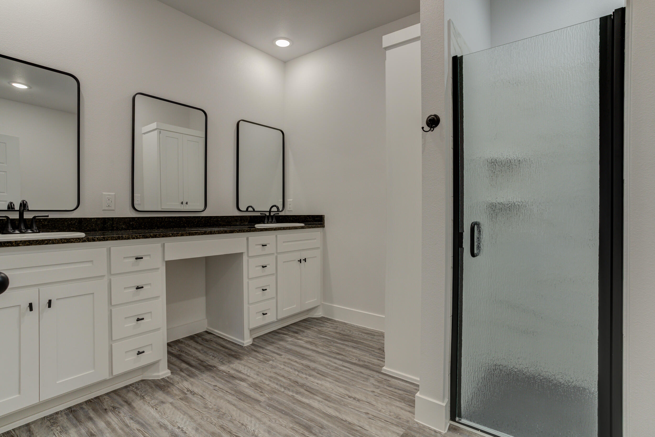 6926 12th Street Lubbock, TX 79416 - Photo 25 of 39 a view of cabinets with wooden floor