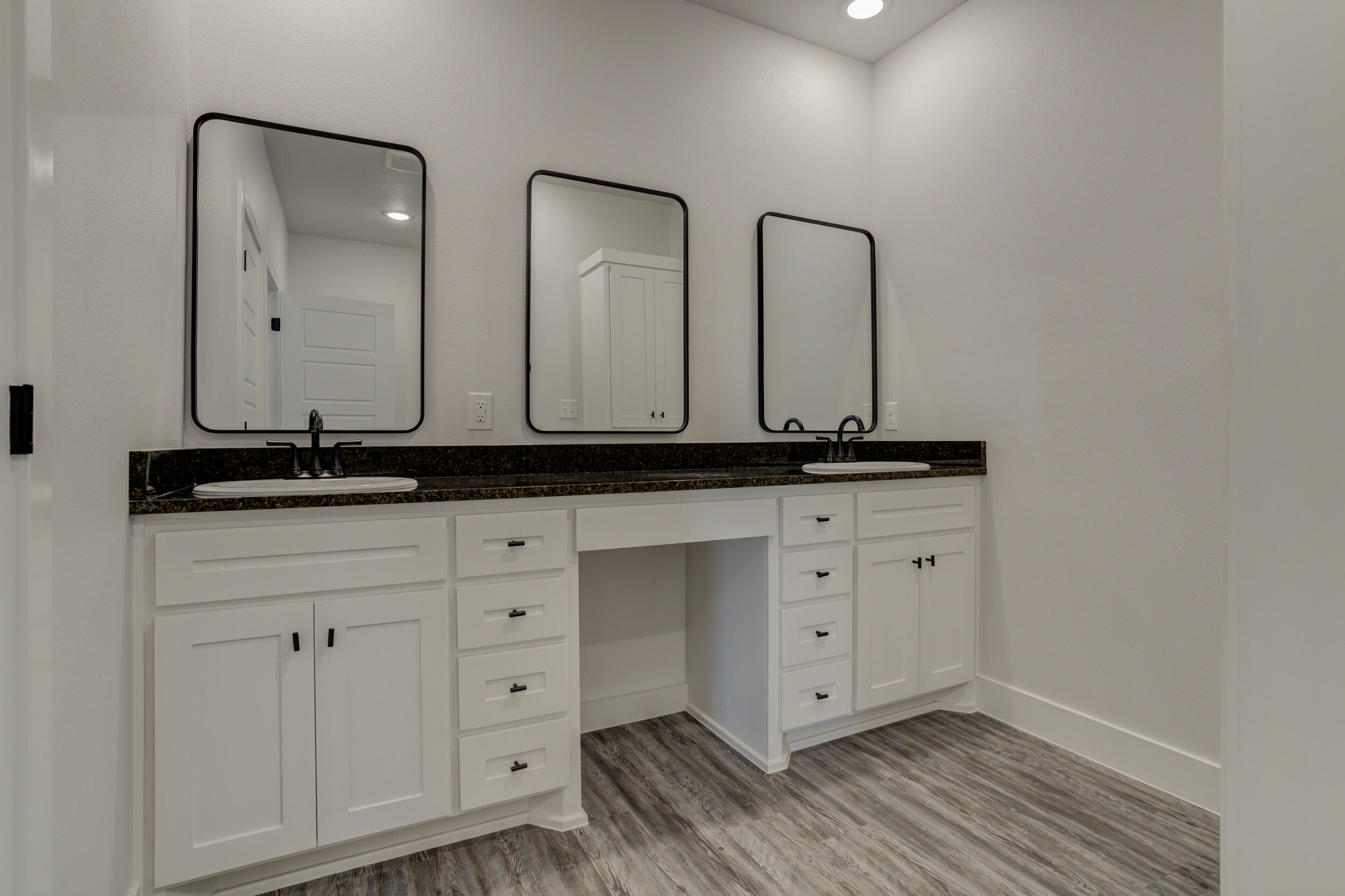 6926 12th Street Lubbock, TX 79416 - Photo 26 of 39 a view of a kitchen with sink and mirror