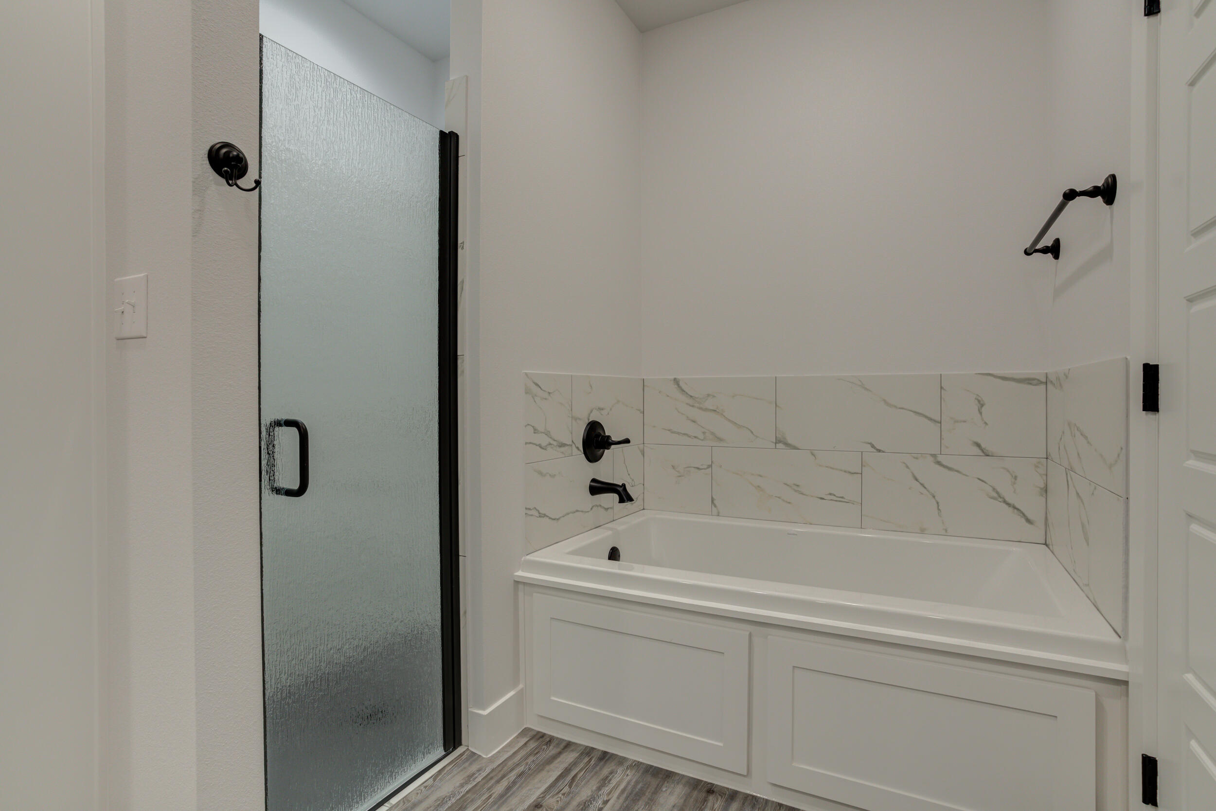 6926 12th Street Lubbock, TX 79416 - Photo 27 of 39 a bathroom with a bathtub