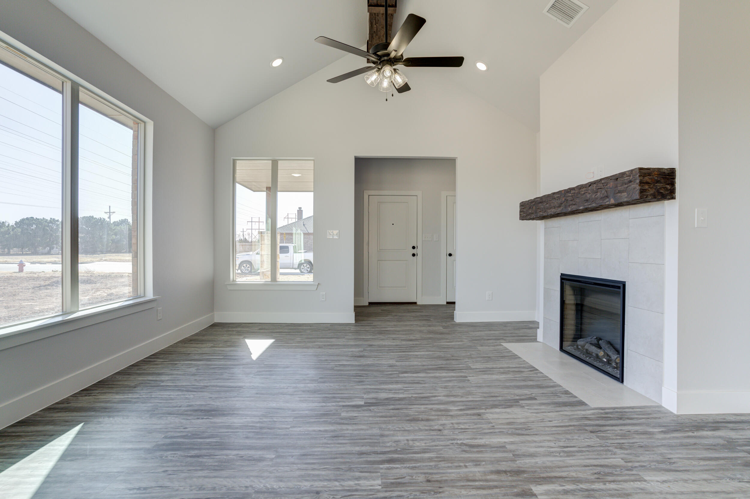 6926 12th Street Lubbock, TX 79416 - Photo 10 of 39 a view of an empty room with window and fire place