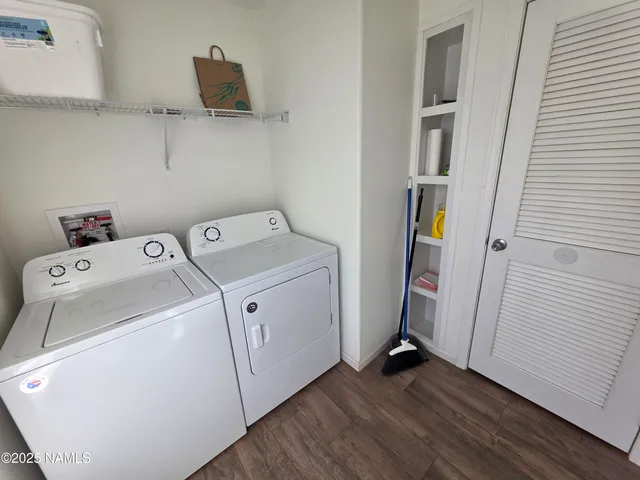 a view of storage and utility room with washer and dryer