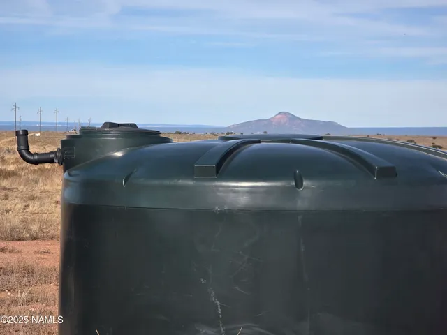 a view of a road with a yard in the background