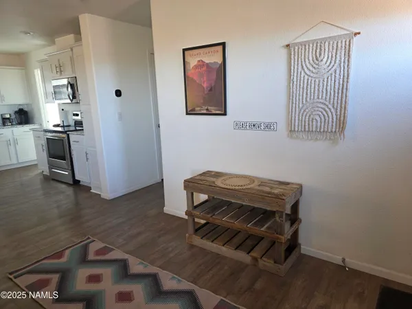 a room with chairs and wooden floor