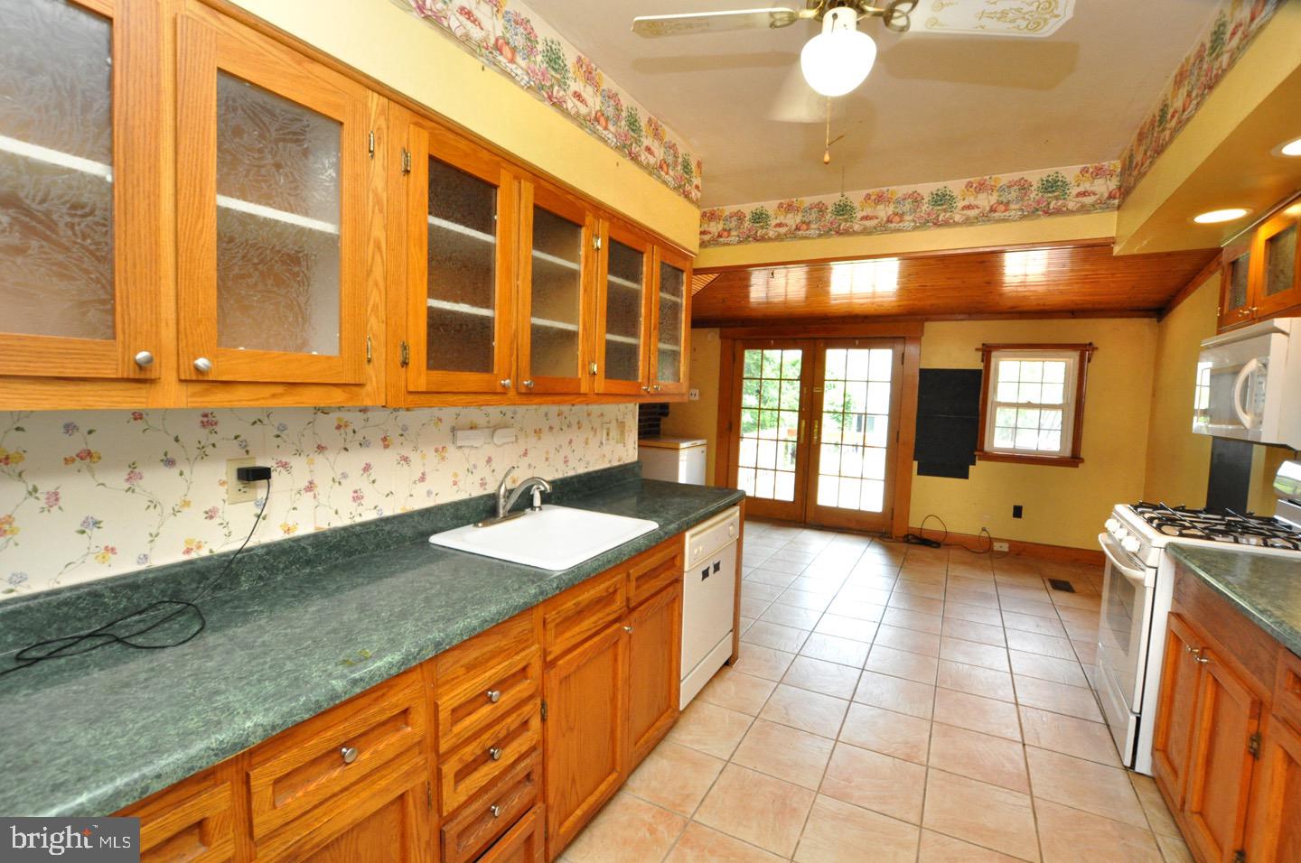 425 Delaware Avenue Riverside, NJ 08075 - Photo 11 of 33 a view of a kitchen with a sink and cabinets