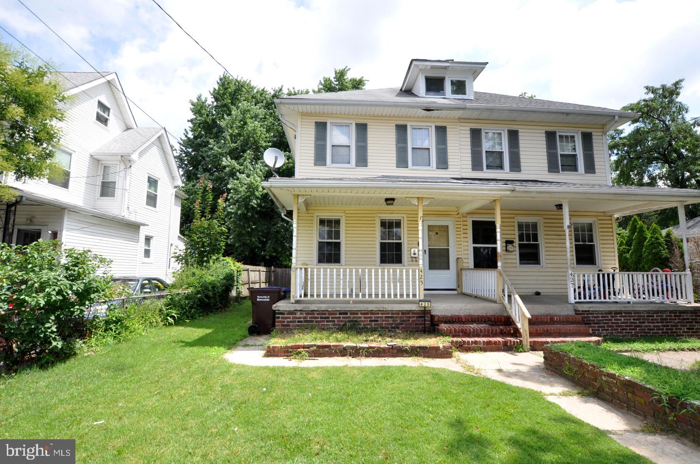 425 Delaware Avenue Riverside, NJ 08075 - Photo 2 of 33 a front view of a house with a yard