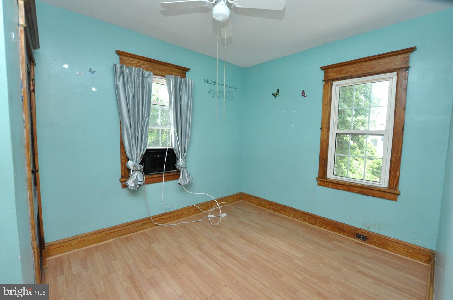 425 Delaware Avenue Riverside, NJ 08075 - Photo 22 of 33 a view of empty room with window and wooden floor