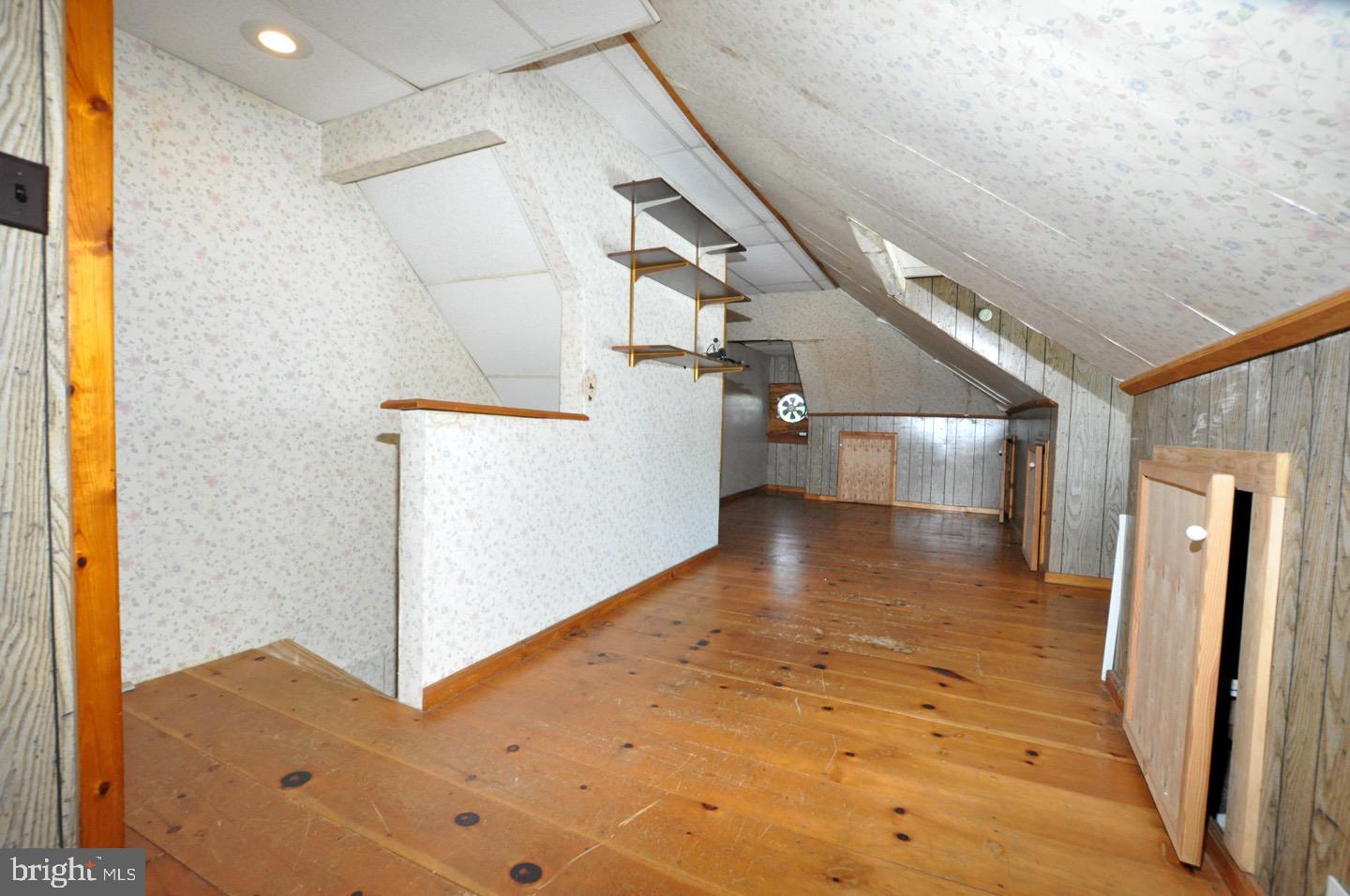 425 Delaware Avenue Riverside, NJ 08075 - Photo 27 of 33 a view of a hallway to an empty room and wooden floor