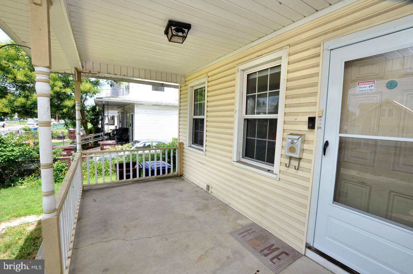425 Delaware Avenue Riverside, NJ 08075 - Photo 4 of 33 a view of a porch with furniture and floor to ceiling window