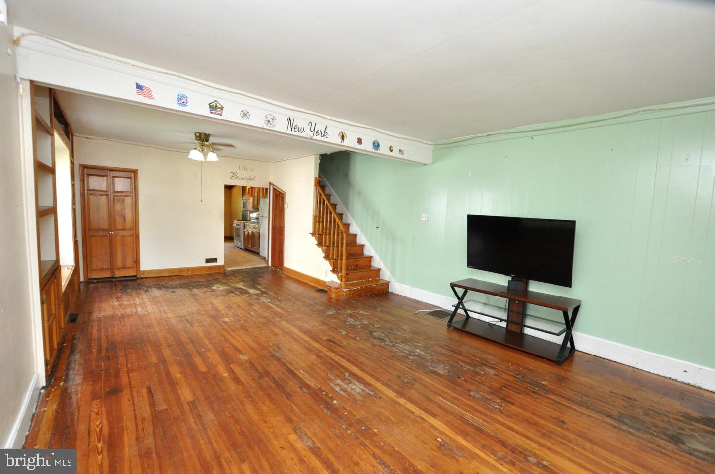 425 Delaware Avenue Riverside, NJ 08075 - Photo 6 of 33 a view of an empty room with wooden floor and a window
