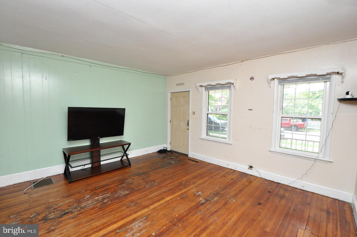 425 Delaware Avenue Riverside, NJ 08075 - Photo 7 of 33 wooden floor in an empty room with a window