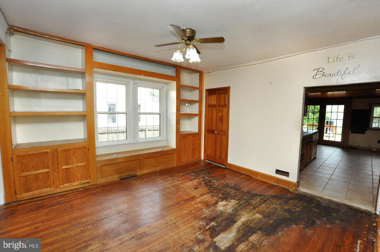 425 Delaware Avenue Riverside, NJ 08075 - Photo 9 of 33 a view of an empty room with a window and wooden floor