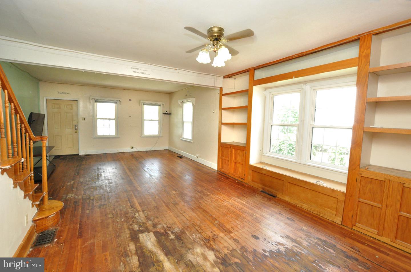425 Delaware Avenue Riverside, NJ 08075 - Photo 10 of 33 a view of an empty room with a window and wooden floor