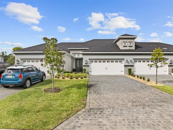 a view of a car park in front of house