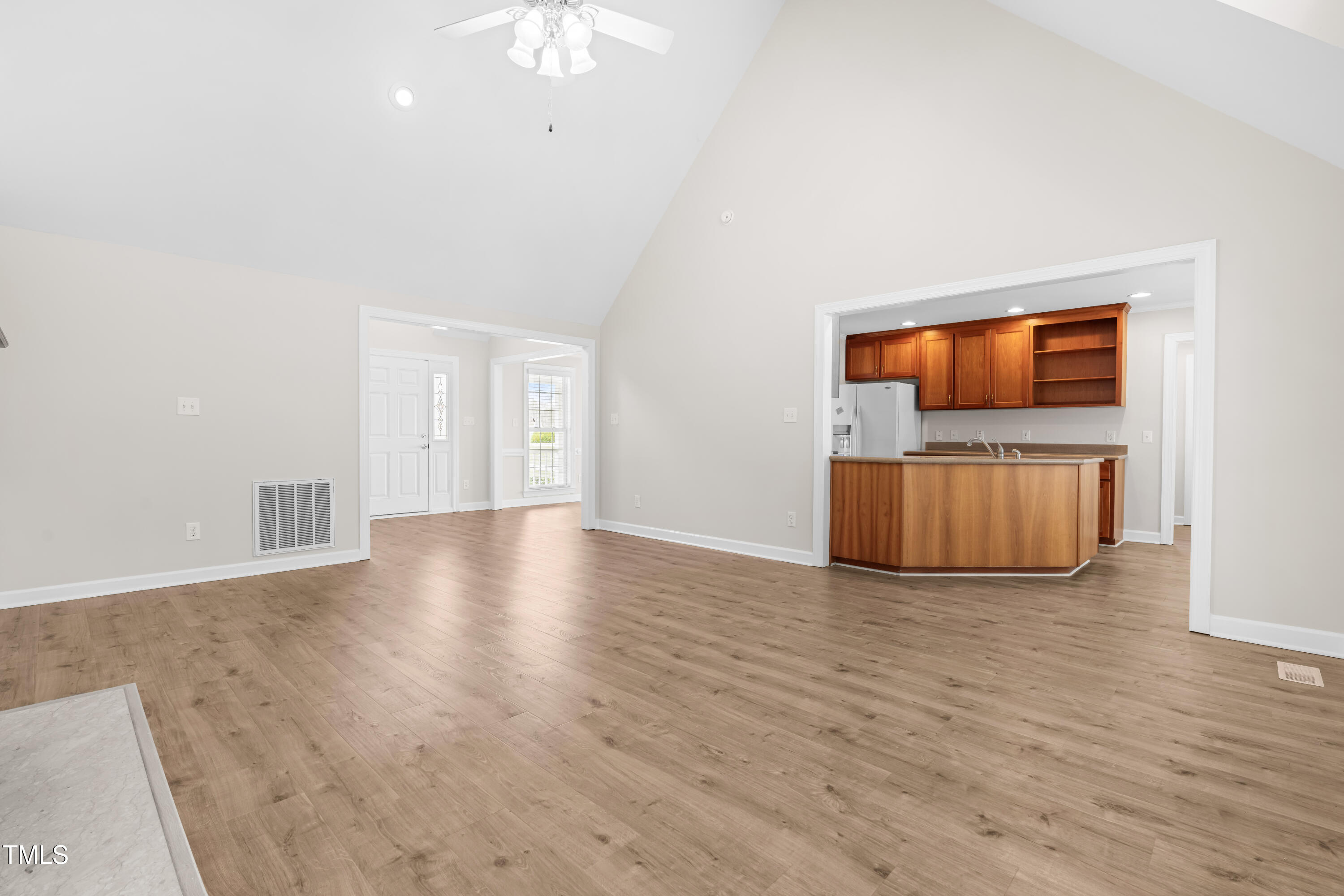 44 Loop Road Archer Lodge, NC 27527 - Photo 18 of 48 a view of empty room with wooden floor and fan