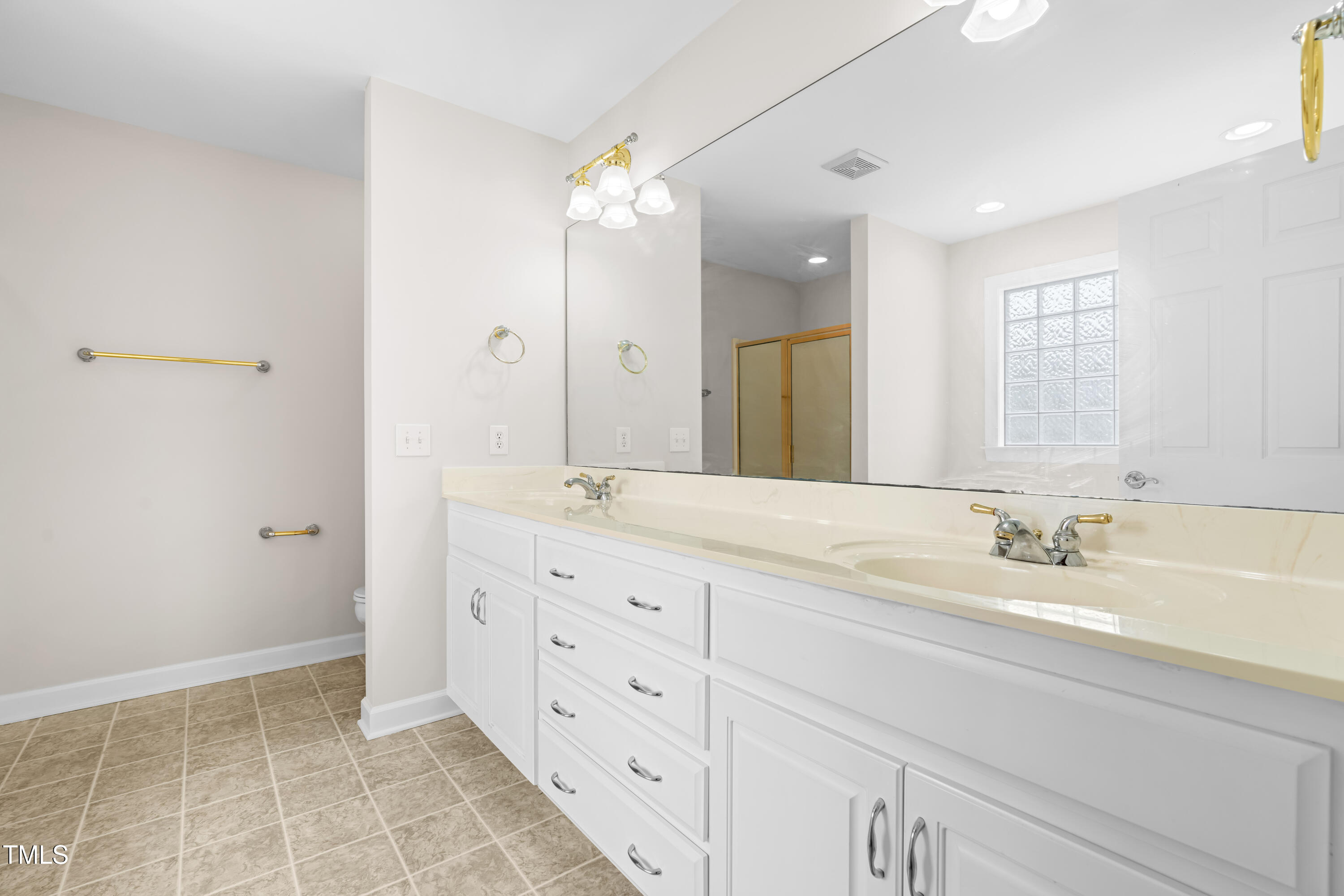 44 Loop Road Archer Lodge, NC 27527 - Photo 25 of 48 a spacious bathroom with a double vanity sink mirror and double