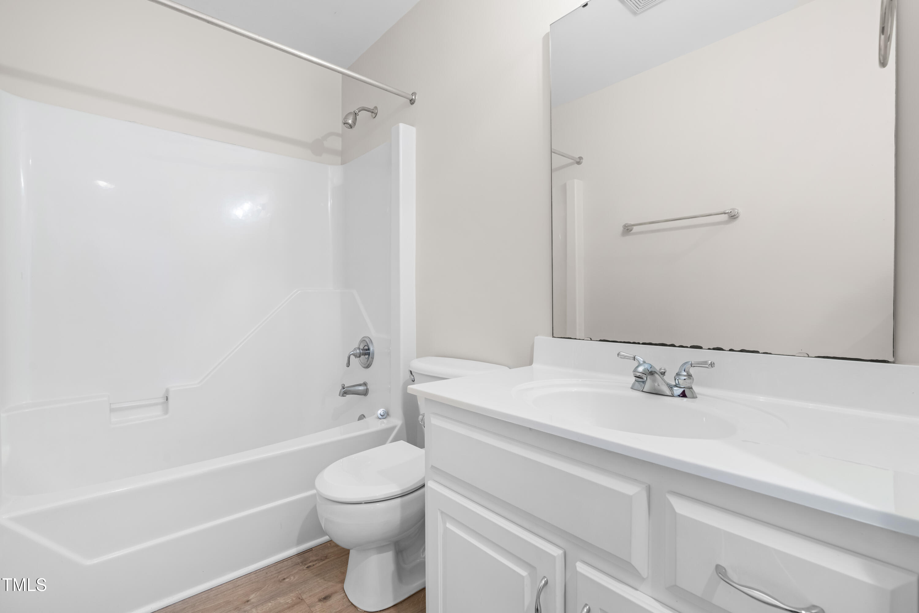 44 Loop Road Archer Lodge, NC 27527 - Photo 29 of 48 a bathroom with a sink a toilet and a bathtub
