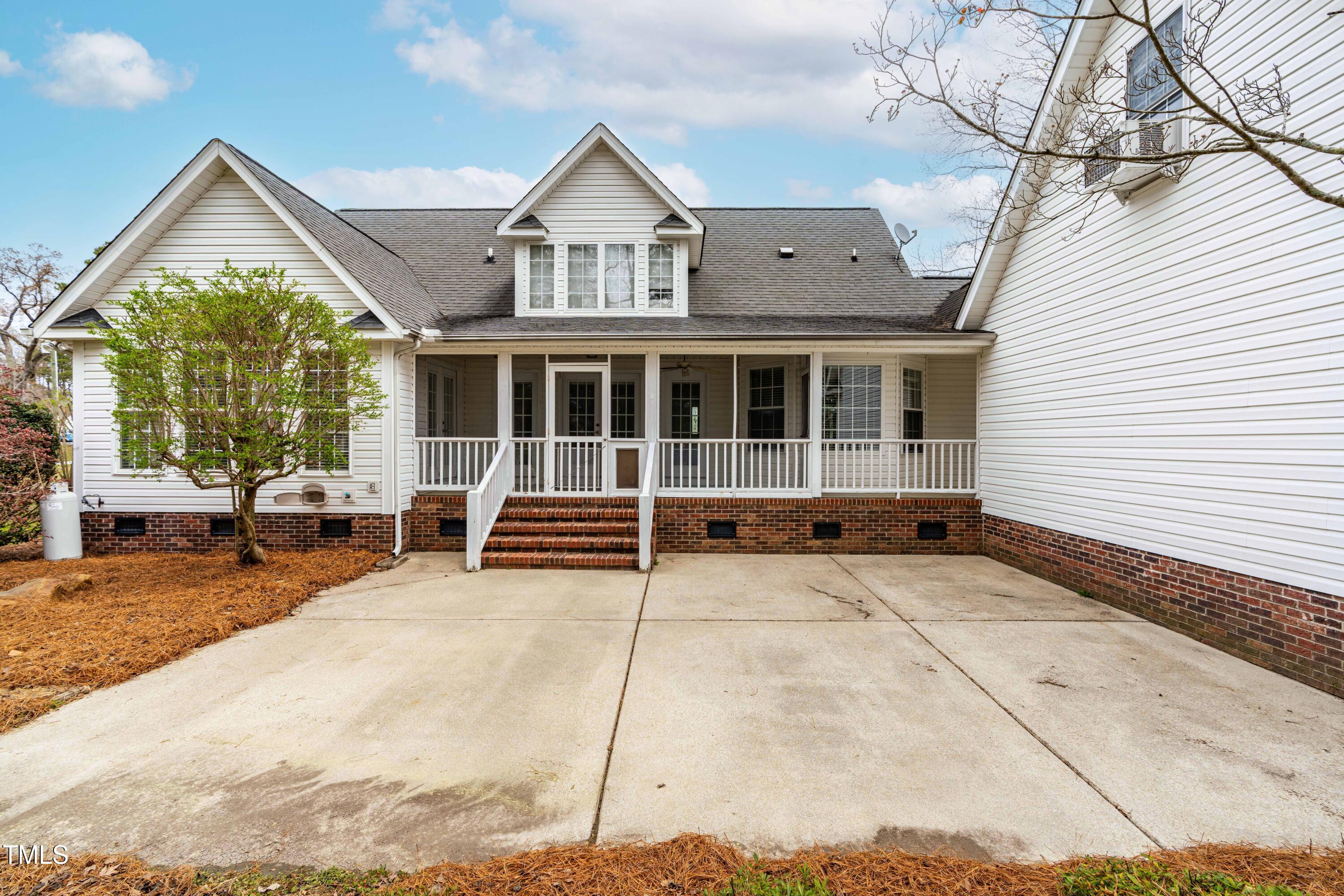 44 Loop Road Archer Lodge, NC 27527 - Photo 32 of 48 a view of a house with a small yard and wooden fence