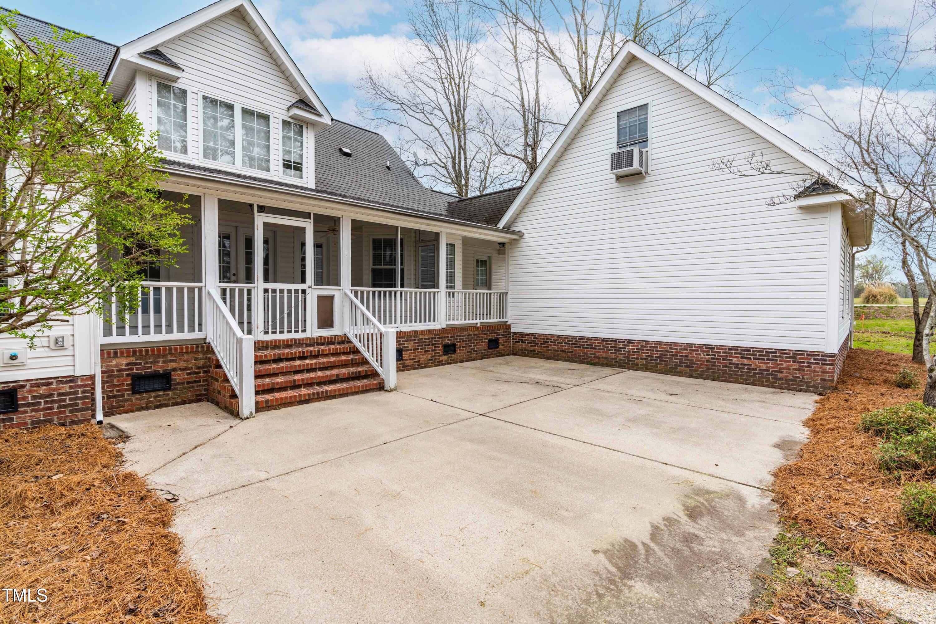 44 Loop Road Archer Lodge, NC 27527 - Photo 33 of 48 a view of a house with a bench