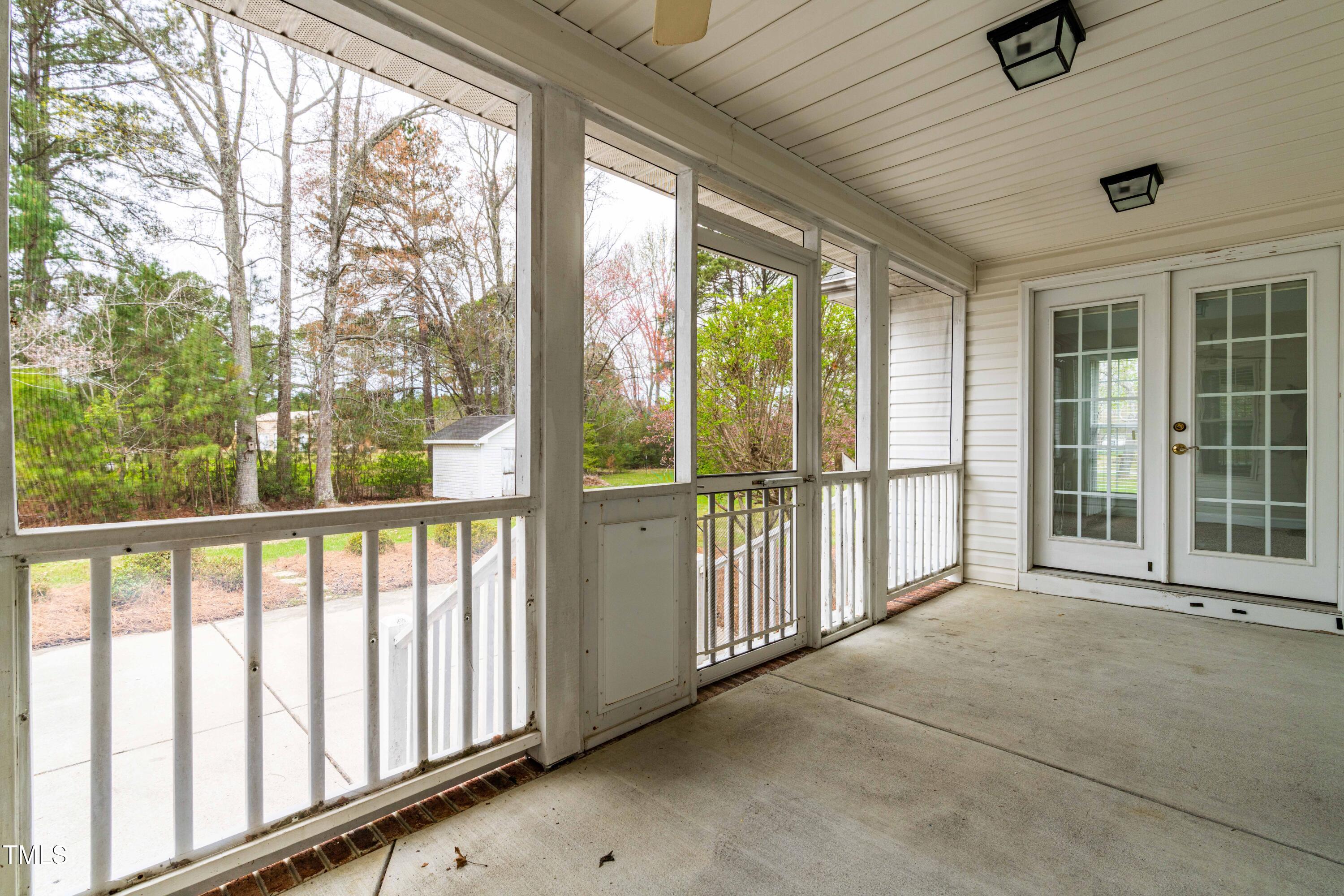 44 Loop Road Archer Lodge, NC 27527 - Photo 36 of 48 a view of a porch with wooden floor and outdoor space