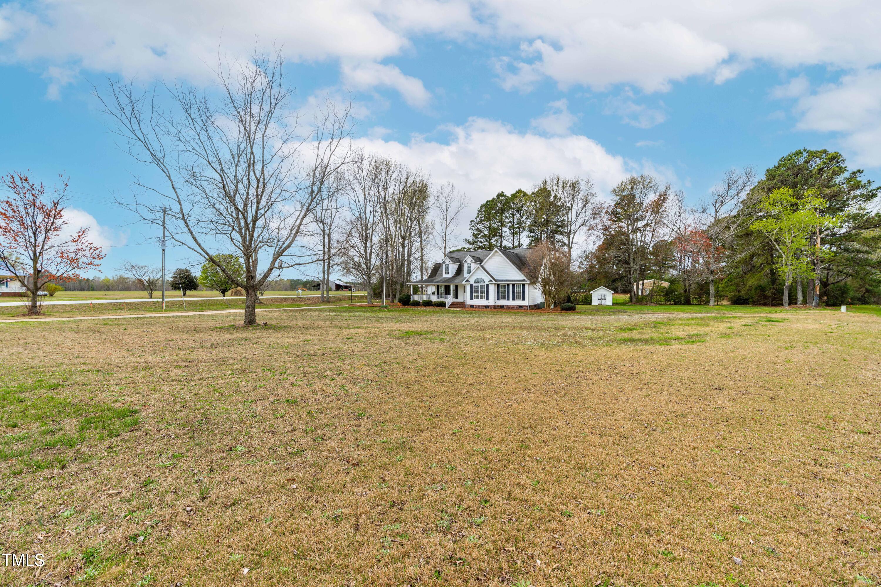 44 Loop Road Archer Lodge, NC 27527 - Photo 40 of 48 a view of a field with an trees