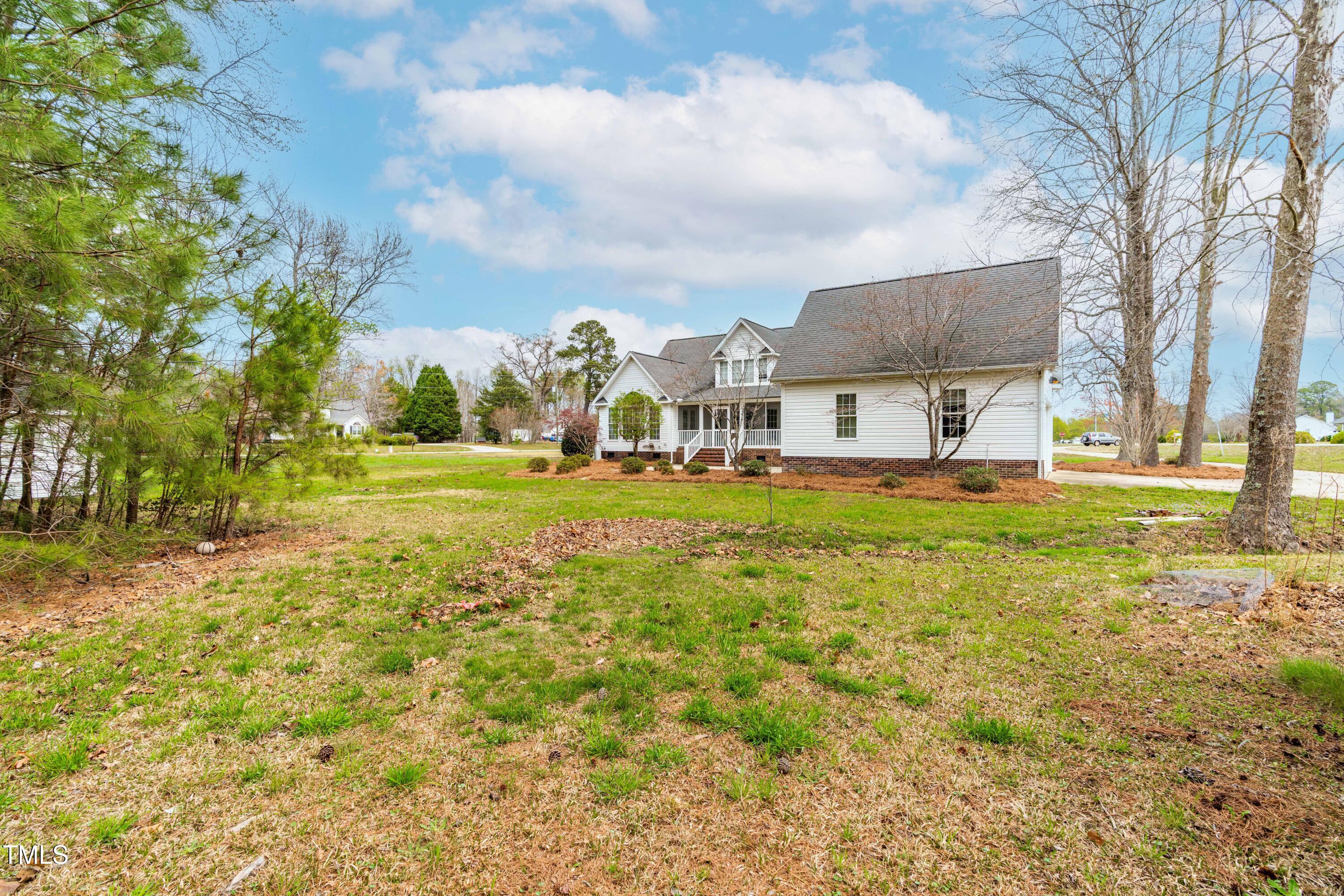 44 Loop Road Archer Lodge, NC 27527 - Photo 44 of 48 a large building with trees in front of it