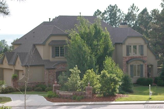 5141 Fox Sparrow Road Parker, CO 80134 - Photo 1 of 1 a front view of a house with garden