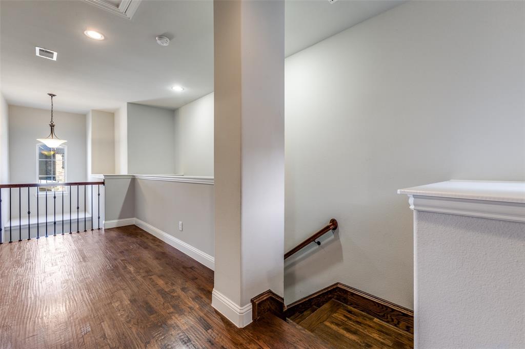 828 Rohan Drive Richardson, TX 75081 - Photo 15 of 25 a view of an empty room with wooden floor and a window