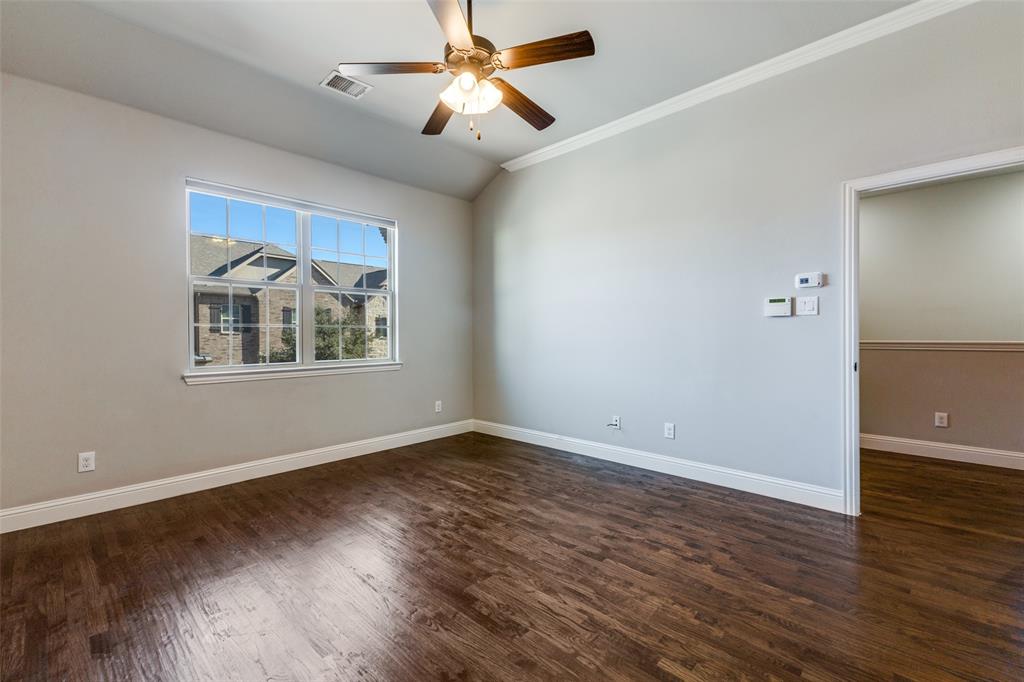828 Rohan Drive Richardson, TX 75081 - Photo 19 of 25 a view of empty room with wooden floor and fan