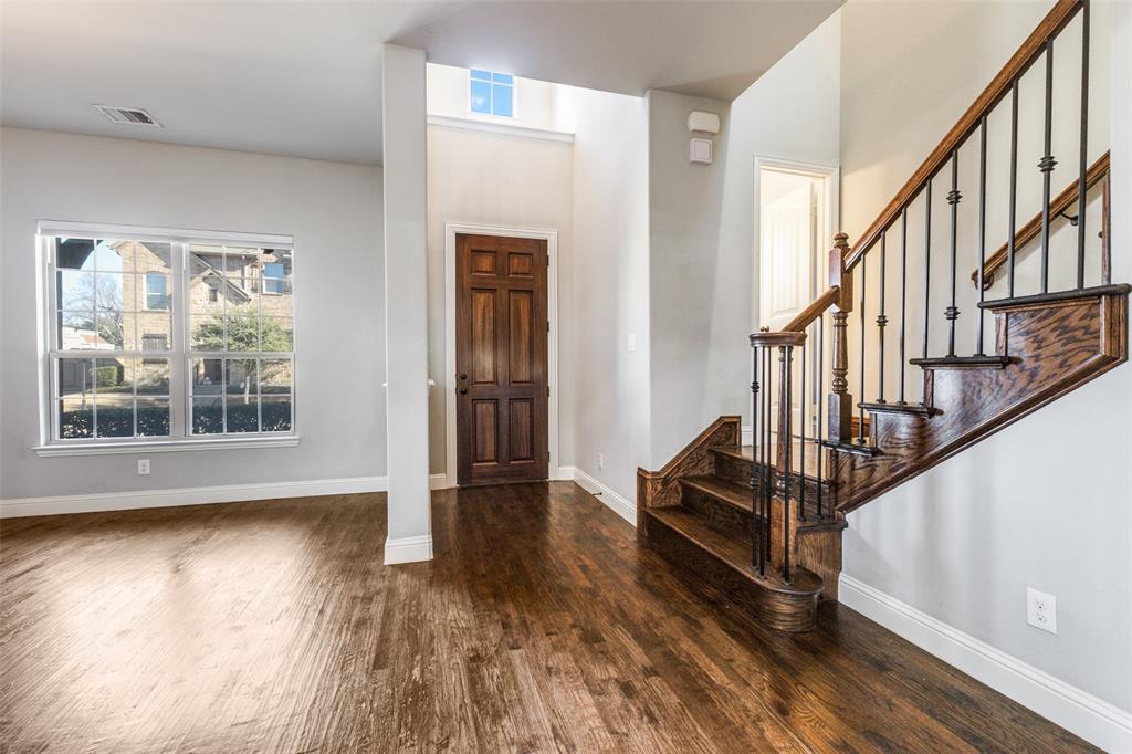 828 Rohan Drive Richardson, TX 75081 - Photo 3 of 25 a view of an entryway with wooden floor and stairs