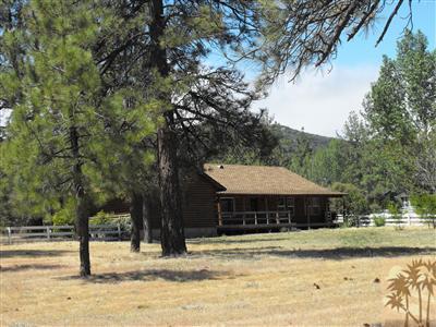 60944 Devils Ladder Road Mountain Center, CA 92561 - Photo 3 of 8 a front view of a house with a yard