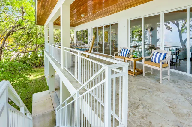 a view of an chairs and table in balcony