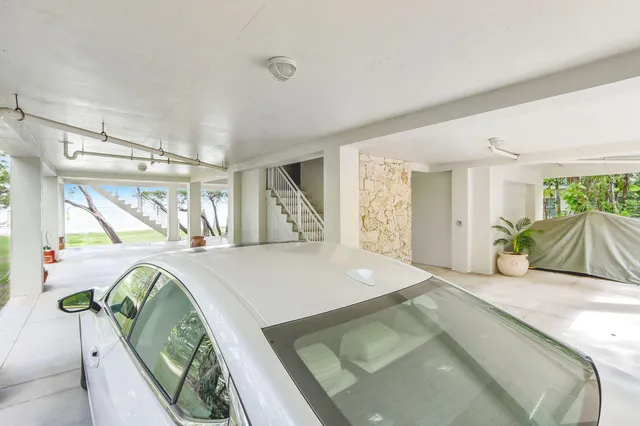 a view of a bedroom with window and natural light
