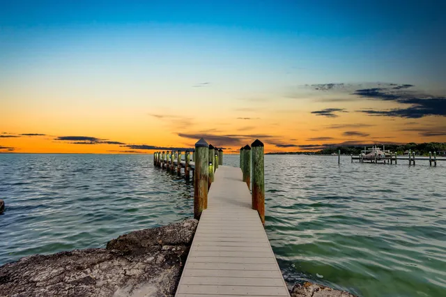 a picture of a room with a white wall and white cabinet