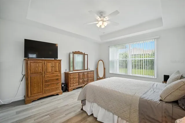 a large bathroom with a double vanity sink a mirror and a bathtub