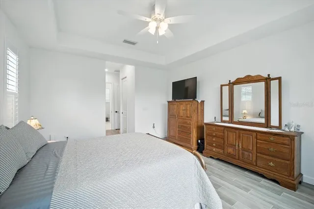 a white bath tub sitting next to a bathroom sink