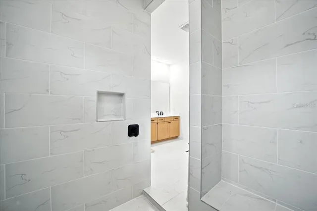 a bathroom with a toilet a sink a mirror and vanity