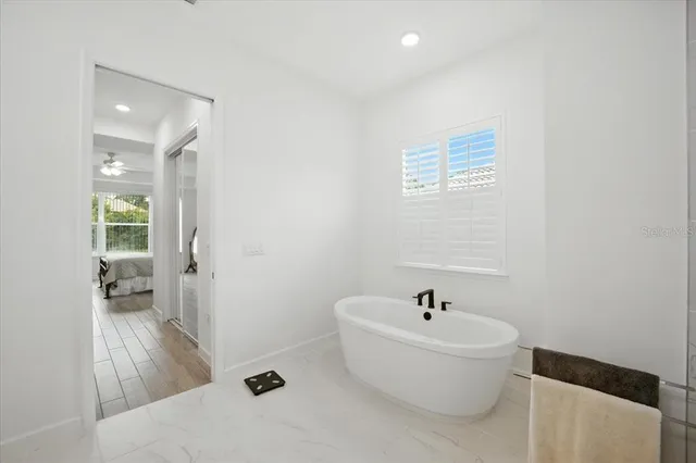 a bathroom with a tub and shower
