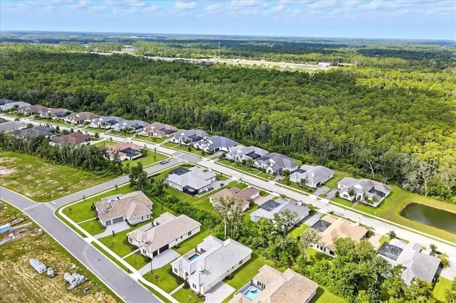 an aerial view of a house with a garden