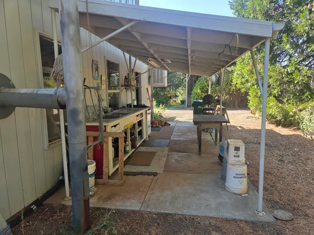 a kitchen with a sink window and cabinets