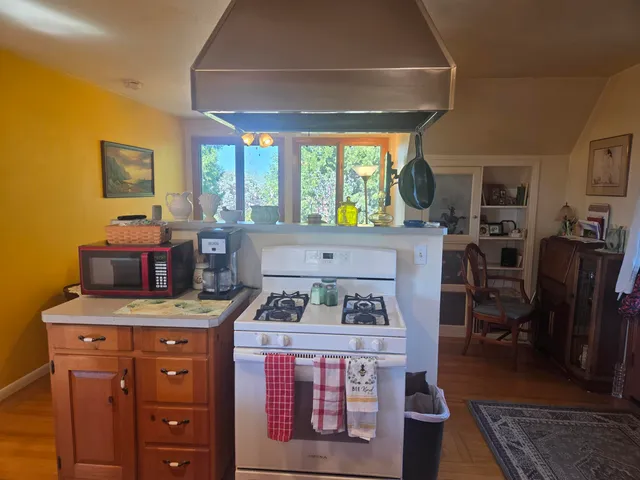 a kitchen with a refrigerator and a sink